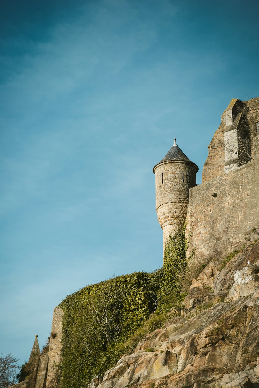 gray castle under blue and white sky