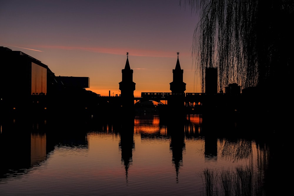 buildings and body of water during golden hour