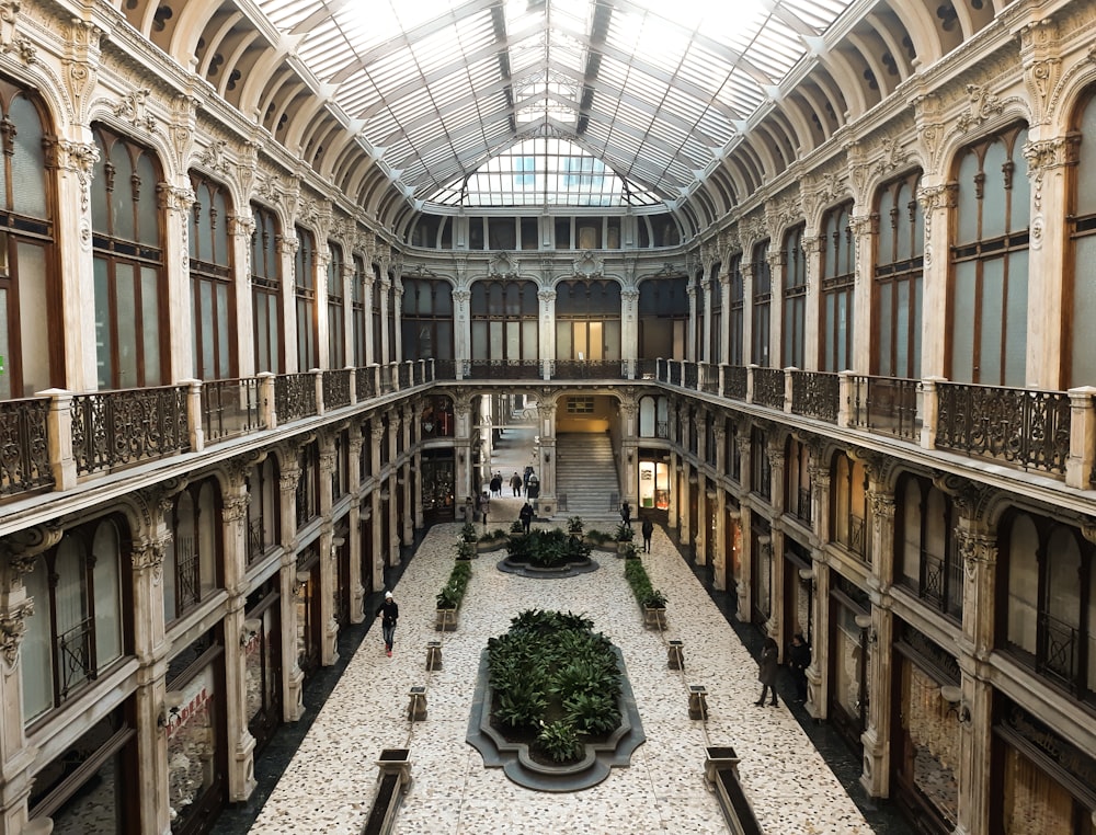 few people walking inside Galleria Subalpina in city of Turin
