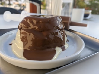 A delicious dessert served on a rustic wooden table at Domuss restaurant