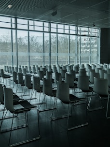 Sunlit conference room with modern furnishings and city views.