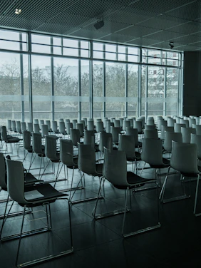 A sleek, modern conference room overlooking Shanghai’s skyline during sunset.