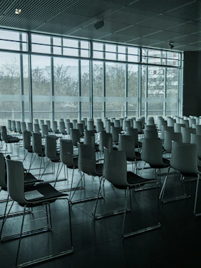Executive meeting room with panoramic city views and minimalist decor.
