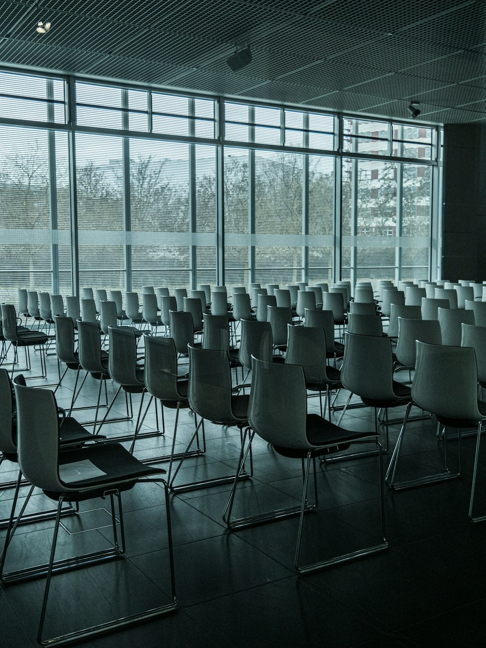 grayscale photography of chairs in room