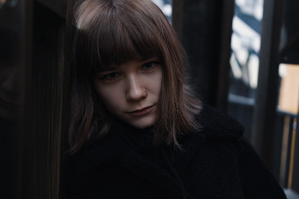 portrait photography of woman wearing black jacket