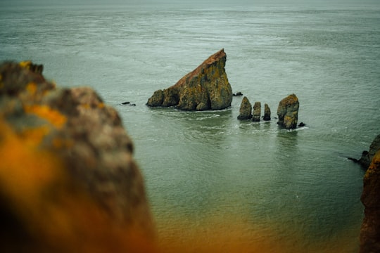 bird's eye photography of rock formation on body of water in Cape Split Canada