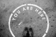 person wearing black leather shoes