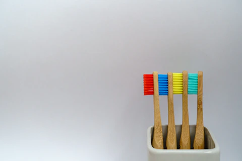 four assorted-color toothbrushes