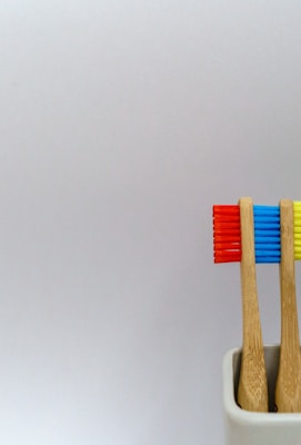 four assorted-color toothbrushes
