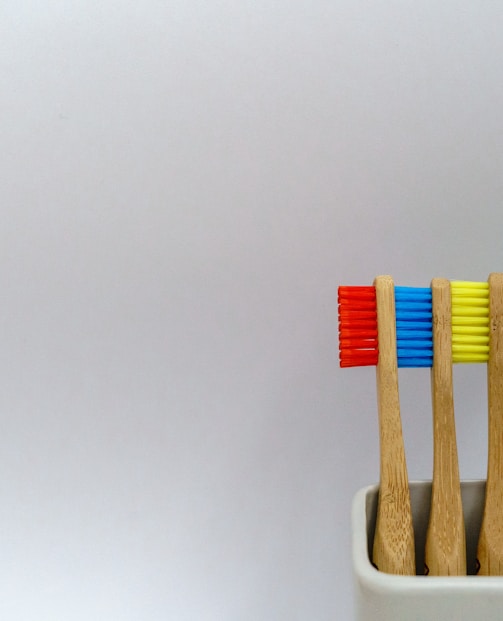 four assorted-color toothbrushes