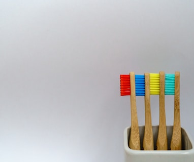 four assorted-color toothbrushes