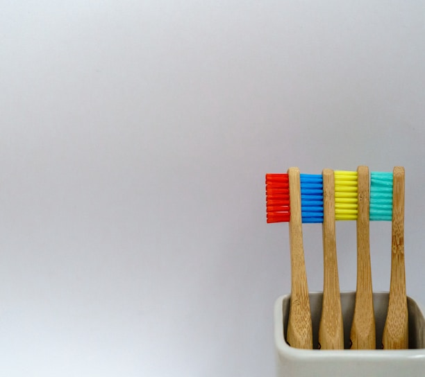 four assorted-color toothbrushes