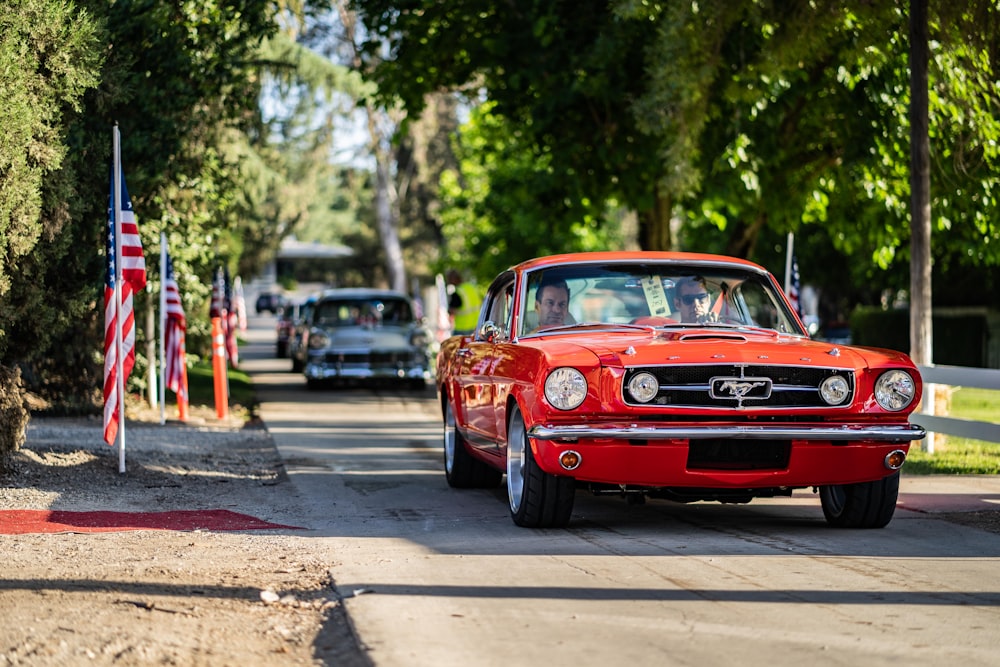 red muscle car on road