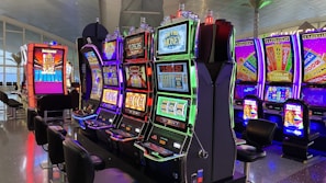 empty chairs in front of arcade machines
