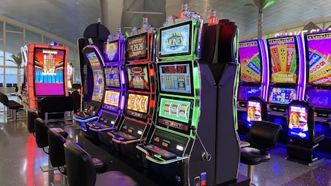 empty chairs in front of arcade machines