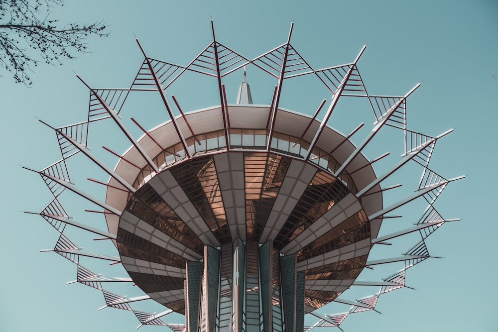 a tall metal tower with a sky background