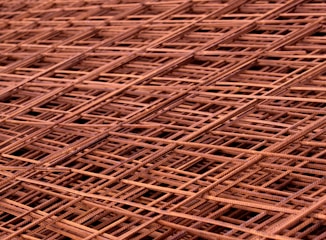 Microscopic view of metal microstructure revealing grain boundaries and phases.