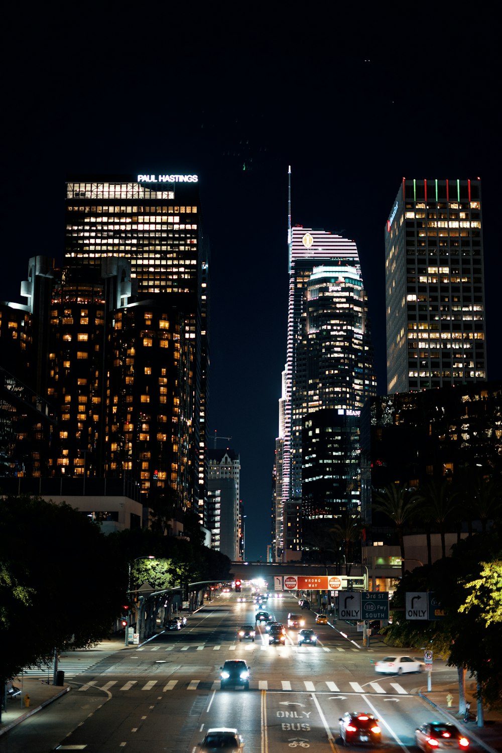 photography of vehicles traveling on road during nighttime