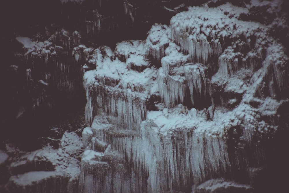 a black and white photo of a waterfall