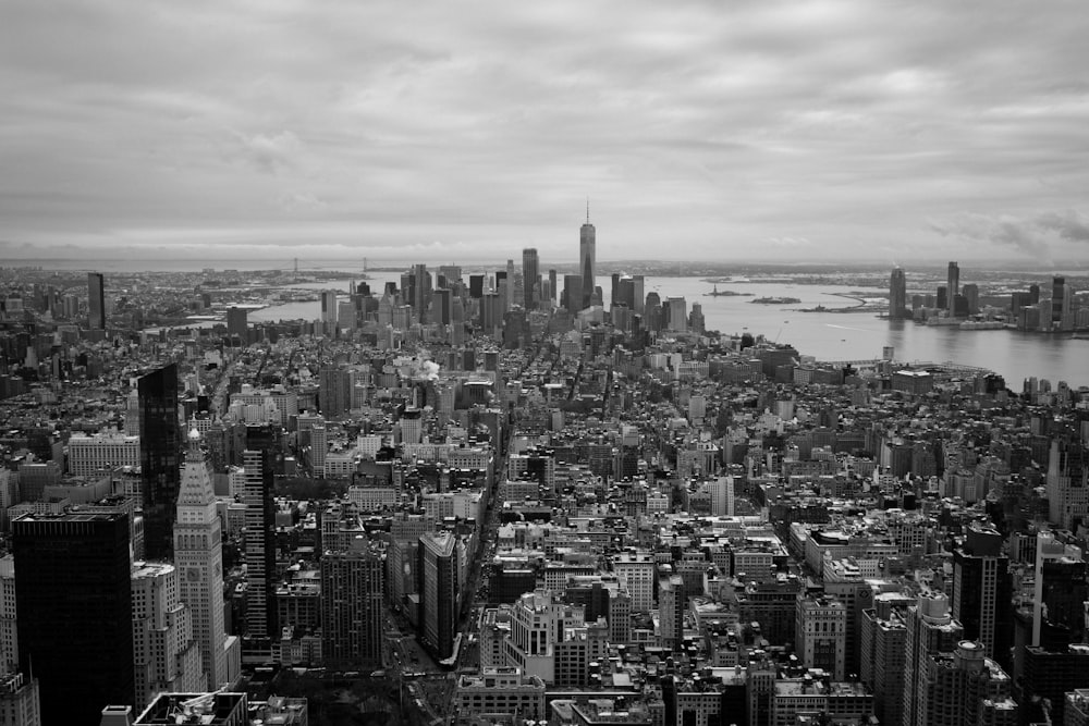 grayscale photography of city high rise buildings