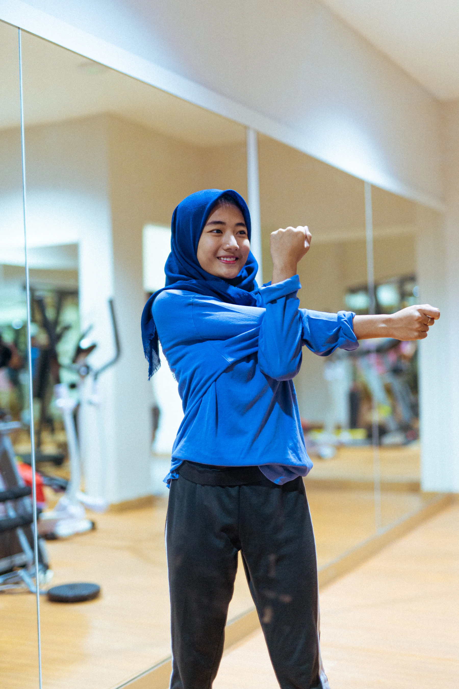 Woman stretching in a gym