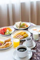 assorted cooked foods and sliced fruits