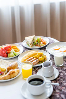 assorted cooked foods and sliced fruits