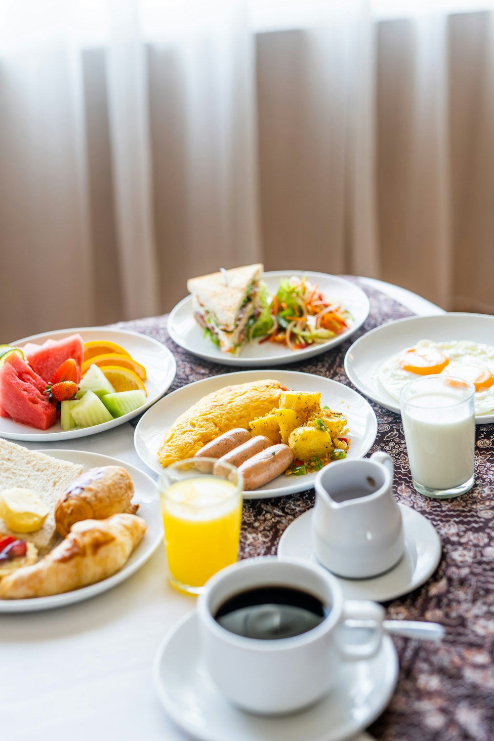 assorted cooked foods and sliced fruits