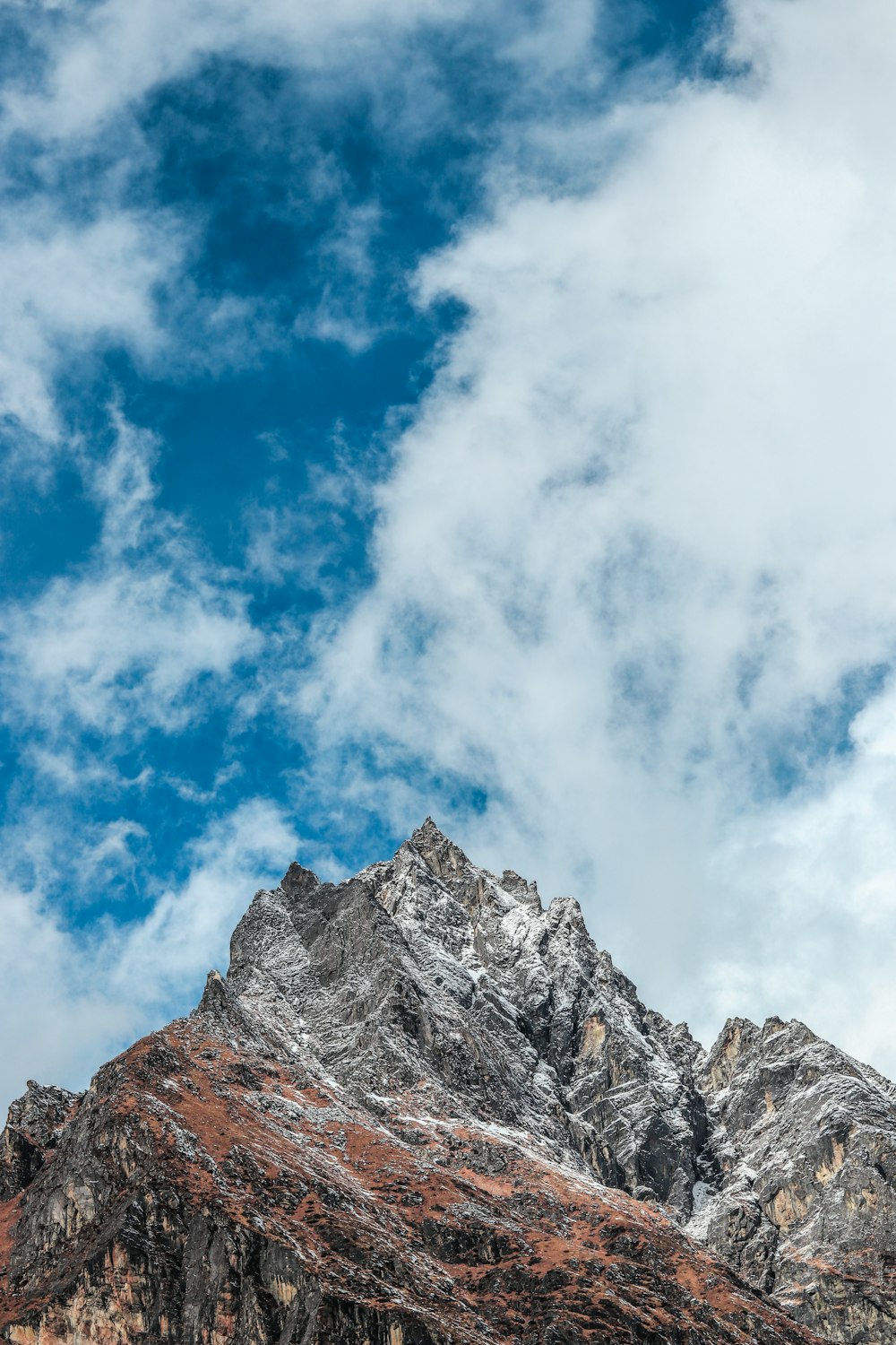 rock formation under cloudy sky