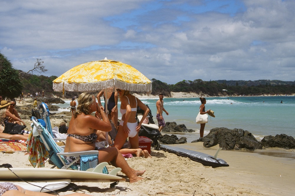 women sitting on beach