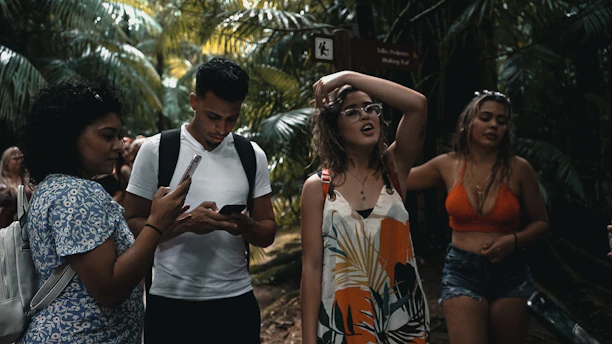A vibrant group enjoying a guided tour through lush Riviera Maya jungle trails.