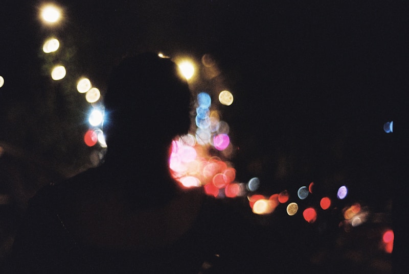 a blurry photo of a person standing in the dark