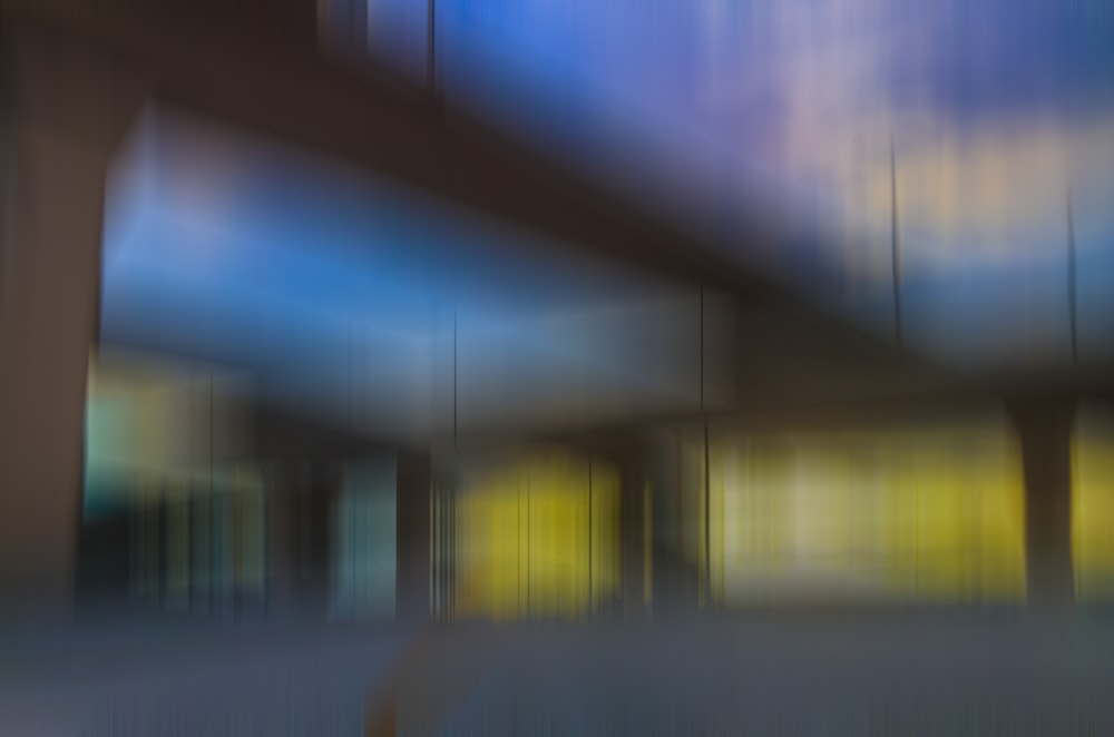a blurry photo of a building with a bridge in the background