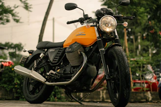 A vintage 2-stroke motorcycle roaring on the street, showcasing the custom exhaust sound.