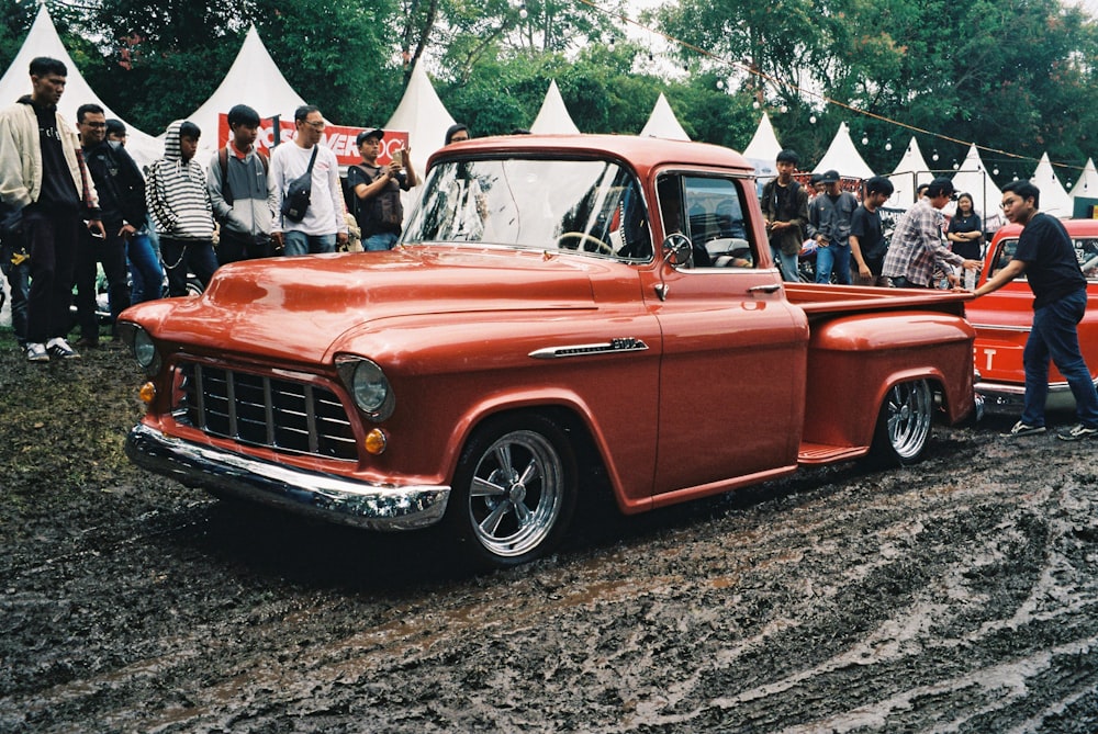 red single cab pickup truck