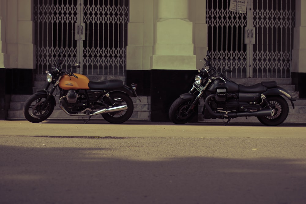 two black and brown standard motorcycles
