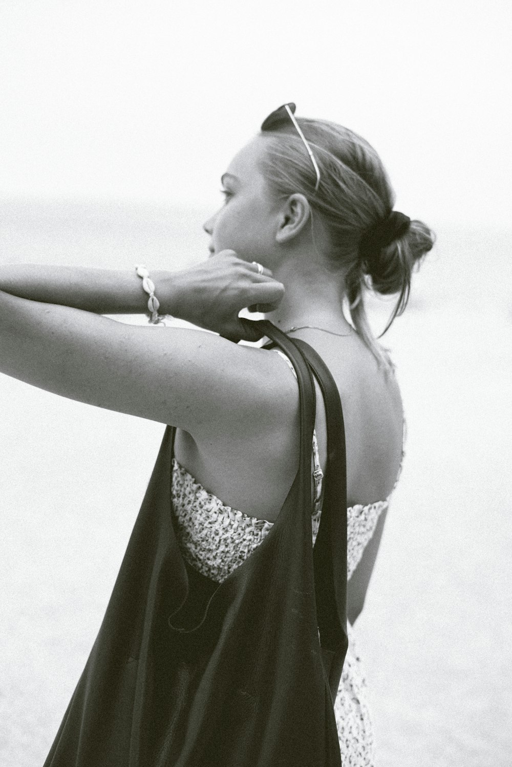 grayscale photo of woman wearing cami top