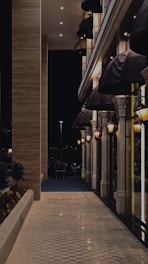 Elegant hotel corridor with soft lighting and green accents.