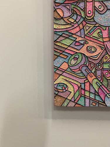 An abstract artwork featuring a multitude of geometric shapes and forms, outlined in black and filled with a spectrum of pastel colors. The textured surface adds depth and dimension, with swirling patterns and intersecting lines creating a sense of movement within the composition.