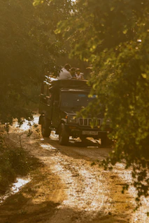 Group enjoying an adventurous 4x4 tour through muddy trails in Tena.