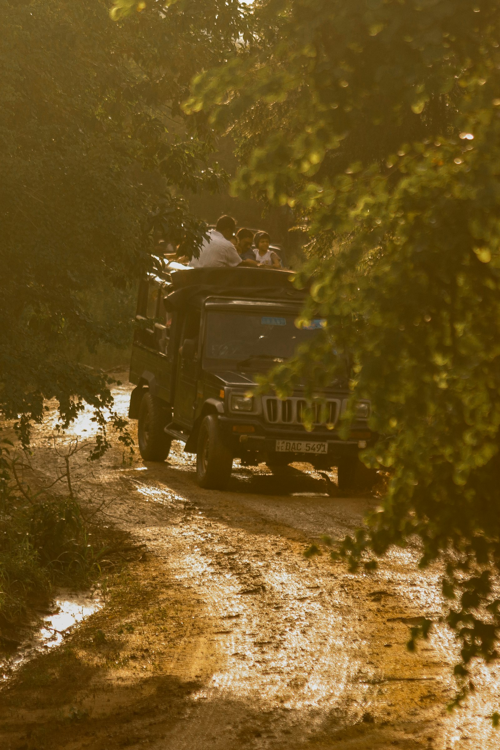 Canon EF 100-300mm F4.5-5.6 USM sample photo. People riding black truck photography