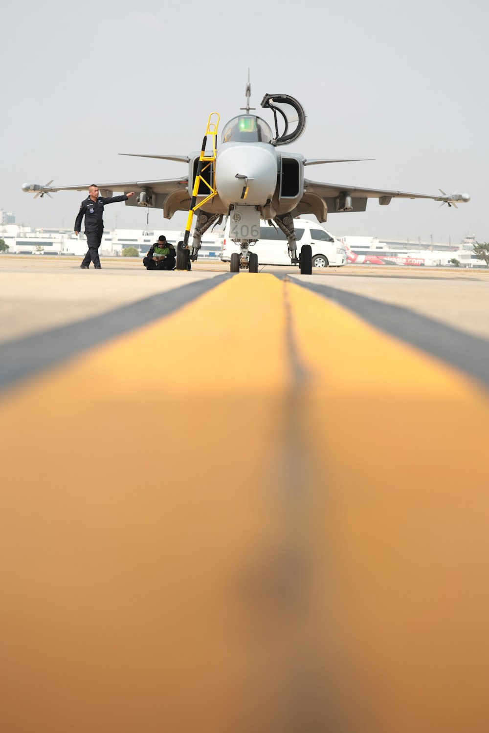 man standing near white fighter plane