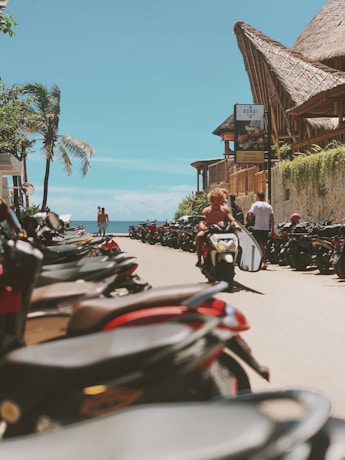 parked motorcycles near beach at canggu by giligate