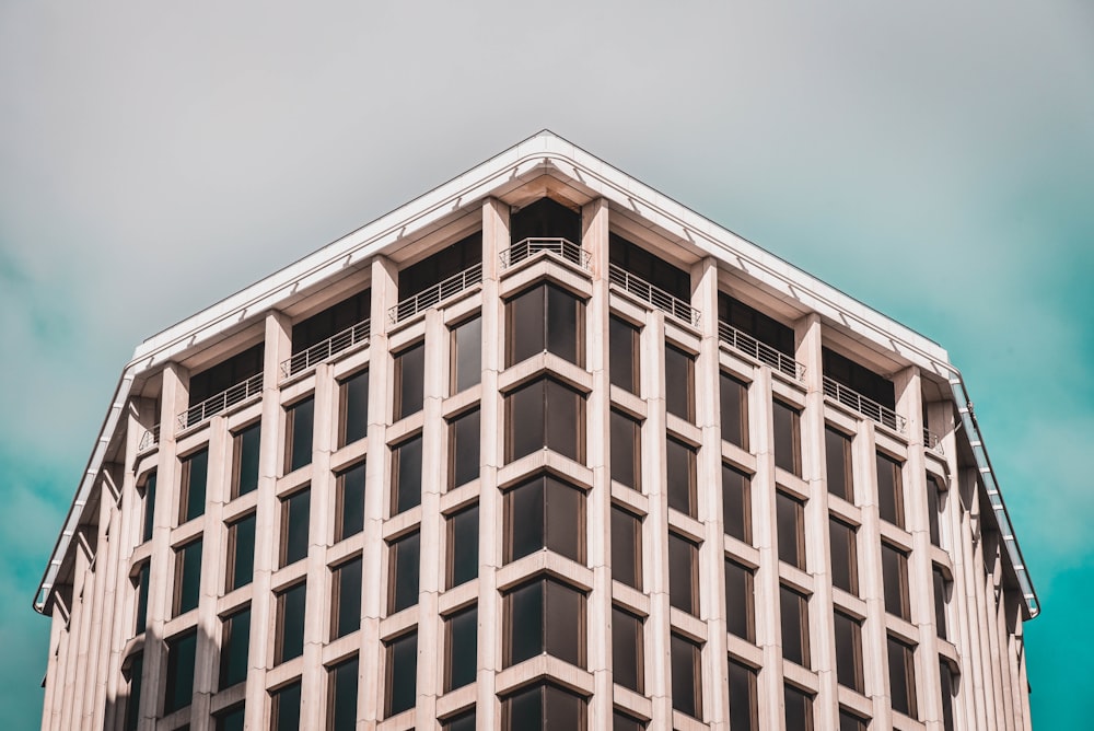 a tall building with a sky background