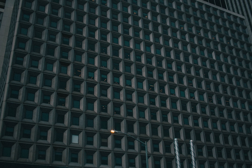 a tall building with a traffic light in front of it