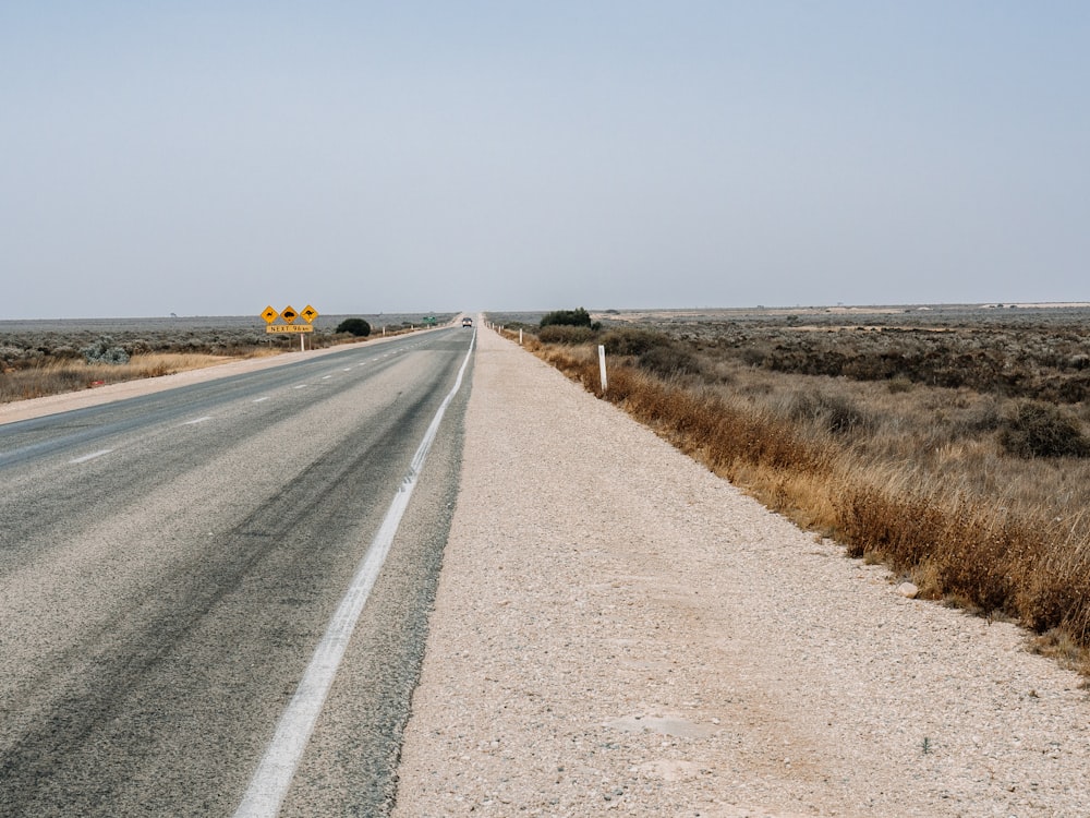 an empty road in the middle of nowhere