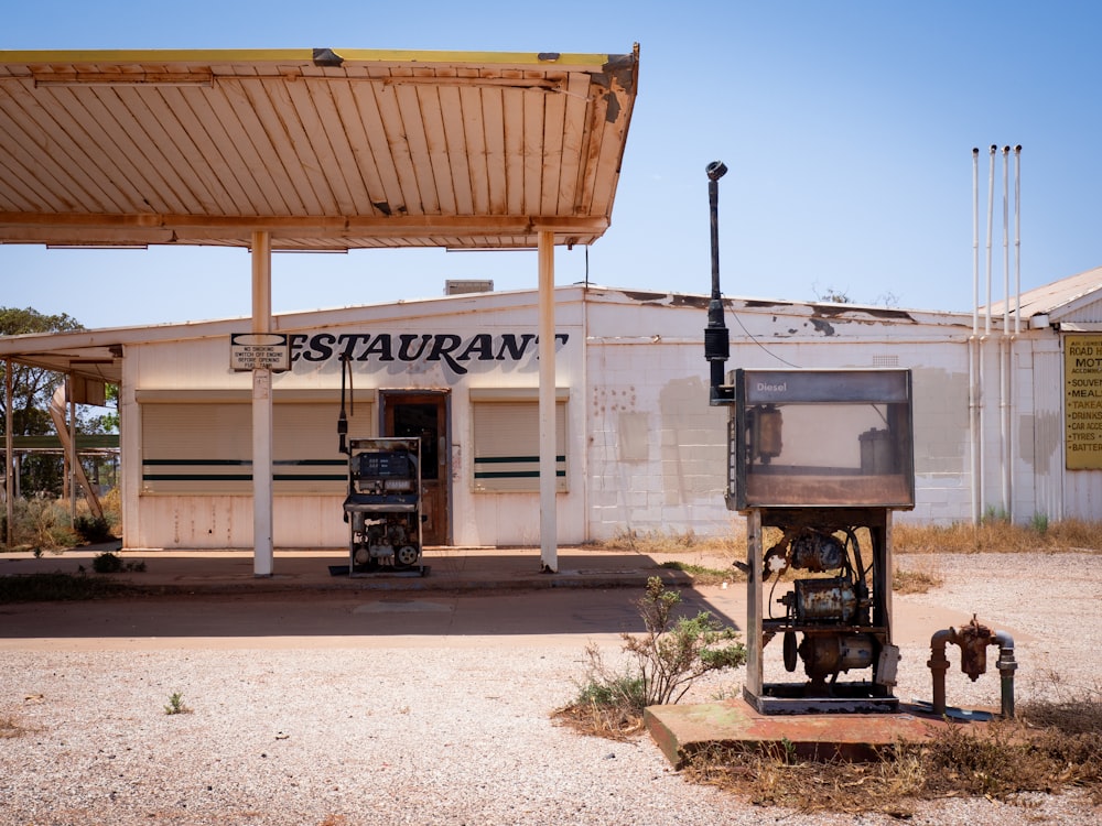 a gas station with a gas pump in front of it