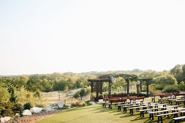 A beautifully decorated outdoor garden setting for a wedding.