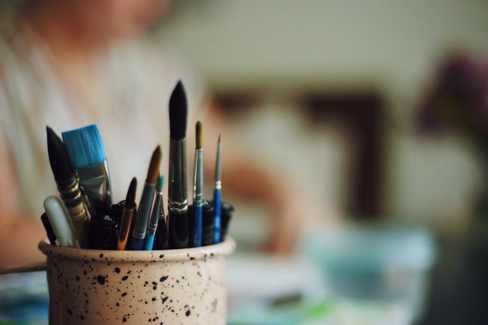 blue hair brushes in vase