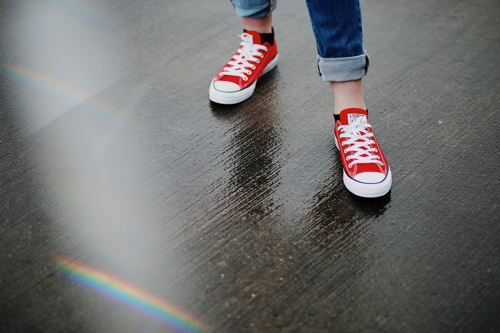 person wearing red Converse All-Star low-top sneakers